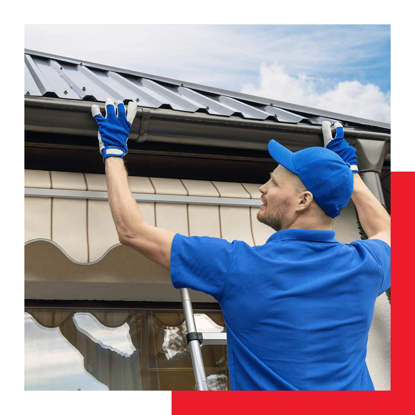 Worker Installing Gutter System on Roof